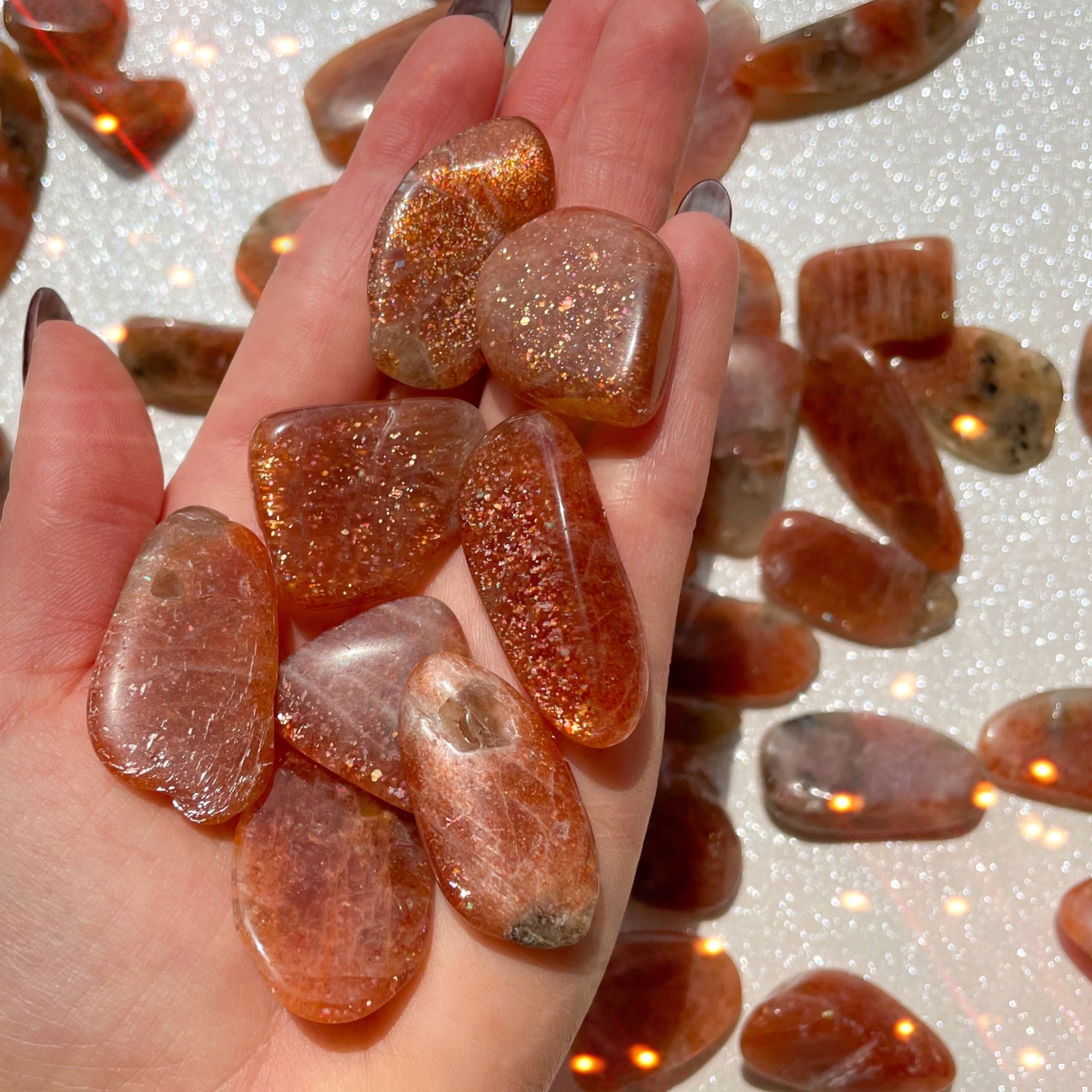 Small-sized Confetti Sunstone tumbled pocket stone.